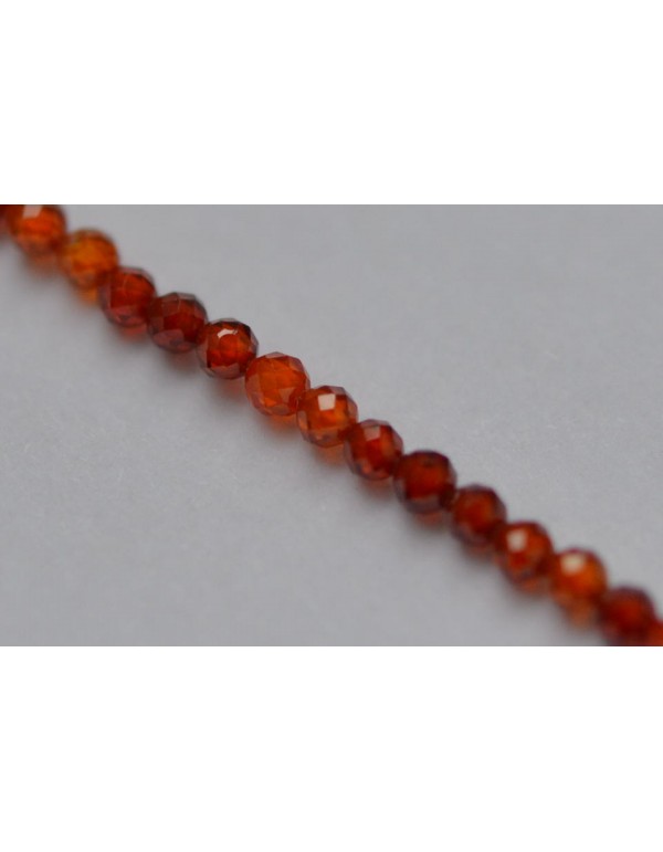 Granato ( orange ) karoliukai, skaidrūs., briaunuoti, 3 mm . 1 juosta ( apie 39 cm.)